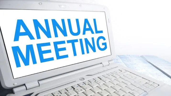 Laptop computer with words Annual Meeting on screen