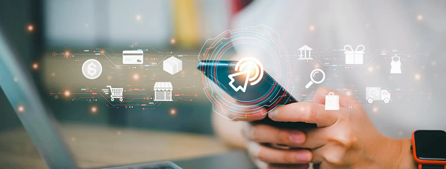 FECU Member paying bills using a mobile phone and computer.   